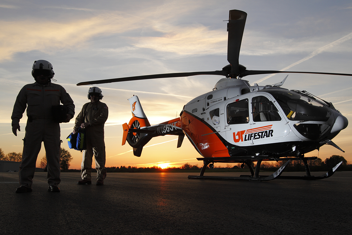 UT LIFESTAR aeromedical helicopter on helipad at sunrise