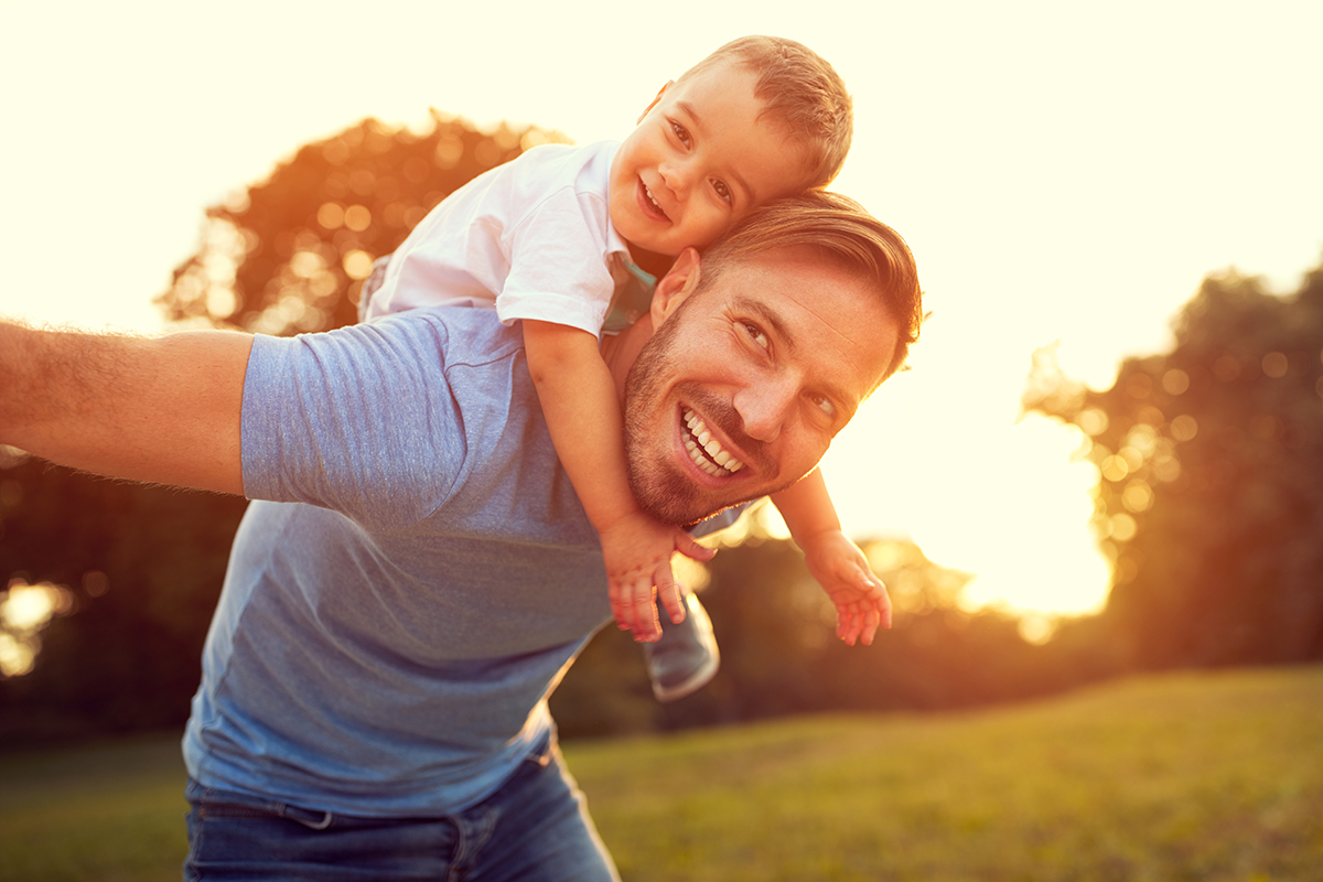 Father and son play outside